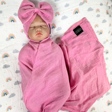 Load image into Gallery viewer, Solid baby pink muslin organic cotton swaddles styled by mommy and me arabia