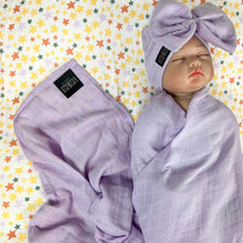 Load image into Gallery viewer, Solid baby purple muslin organic cotton swaddles styled by mommy and me arabia