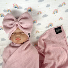 Load image into Gallery viewer, Solid rustic pink muslin organic cotton swaddles styled by mommy and me arabia