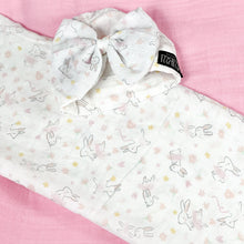 Load image into Gallery viewer, Happy bunny pink printed Muslin organic cotton swaddles styled by mommy and me arabia