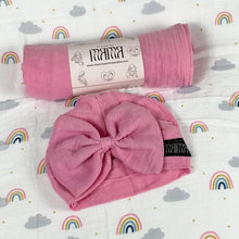 Load image into Gallery viewer, Solid baby pink muslin organic cotton swaddles styled by mommy and me arabia