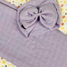 Load image into Gallery viewer, Solid baby purple muslin organic cotton swaddles styled by mommy and me arabia