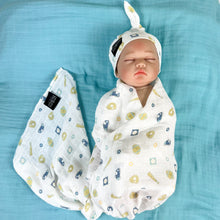 Load image into Gallery viewer, Baby baseball print Muslin organic cotton swaddles styled by mommy and me arabia