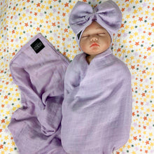 Load image into Gallery viewer, Solid baby purple muslin organic cotton swaddles styled by mommy and me arabia