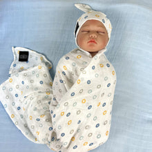 Load image into Gallery viewer, Button stars blue print muslin organic cotton swaddles styled by mommy and me arabia