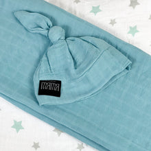 Load image into Gallery viewer, Solid sapphire blue print muslin organic cotton swaddles styled by mommy and me arabia
