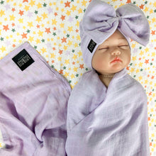 Load image into Gallery viewer, Solid baby purple muslin organic cotton swaddles styled by mommy and me arabia
