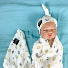 Load image into Gallery viewer, Baby baseball print Muslin organic cotton swaddles styled by mommy and me arabia