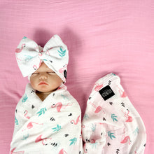 Load image into Gallery viewer, Baby flamingo pink printed Muslin organic cotton swaddles styled by mommy and me arabia