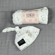 Load image into Gallery viewer, Wild world Muslin organic cotton swaddles styled by mommy and me arabia