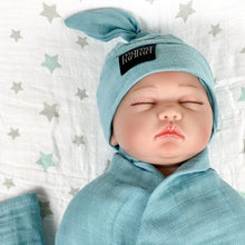Load image into Gallery viewer, Solid sapphire blue print muslin organic cotton swaddles styled by mommy and me arabia