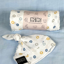 Load image into Gallery viewer, Button stars blue print muslin organic cotton swaddles styled by mommy and me arabia