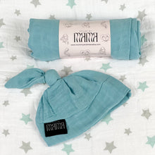 Load image into Gallery viewer, Solid sapphire blue print muslin organic cotton swaddles styled by mommy and me arabia