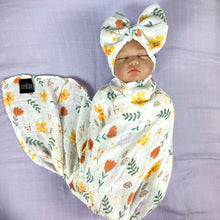 Load image into Gallery viewer, Sunshine blossom muslin organic cotton swaddles styled by mommy and me arabia