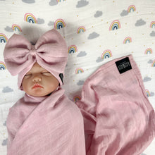 Load image into Gallery viewer, Solid rustic pink muslin organic cotton swaddles styled by mommy and me arabia