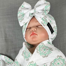 Load image into Gallery viewer, Baby green block printed Muslin organic cotton swaddles styled by mommy and me arabia
