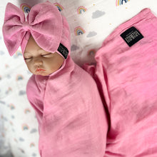 Load image into Gallery viewer, Solid baby pink muslin organic cotton swaddles styled by mommy and me arabia
