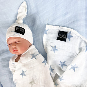 Baby blue stars print muslin organic cotton swaddles styled by mommy and me Arabia