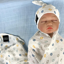 Load image into Gallery viewer, Button stars blue print muslin organic cotton swaddles styled by mommy and me arabia
