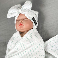 Load image into Gallery viewer, Green polka dots printed Muslin organic cotton swaddles styled by mommy and me arabia
