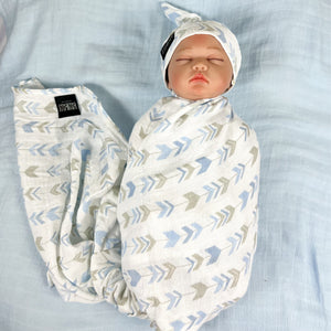 Baby blue arrow print muslin organic cotton swaddles styled by mommy and me Arabia