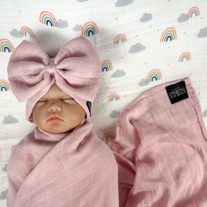 Solid rustic pink muslin organic cotton swaddles styled by mommy and me arabia