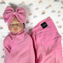 Load image into Gallery viewer, Solid baby pink muslin organic cotton swaddles styled by mommy and me arabia
