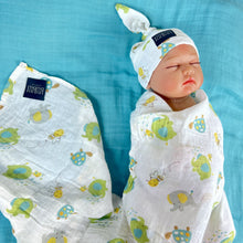 Load image into Gallery viewer, Turtle World printed Muslin organic cotton swaddles styled by mommy and me arabia
