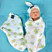 Load image into Gallery viewer, Turtle World printed Muslin organic cotton swaddles styled by mommy and me arabia
