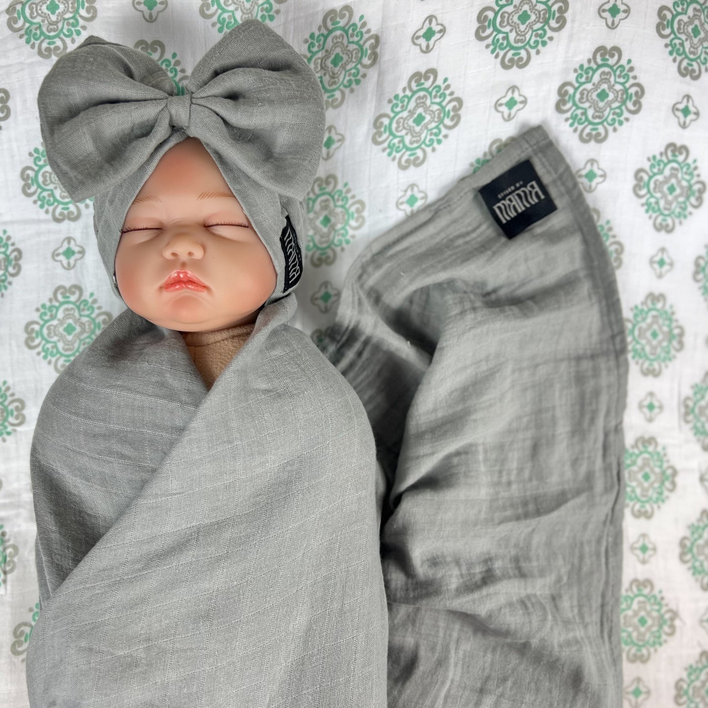 Solid moss grey muslin organic cotton swaddles styled by mommy and me arabia