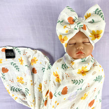 Load image into Gallery viewer, Sunshine blossom muslin organic cotton swaddles styled by mommy and me arabia
