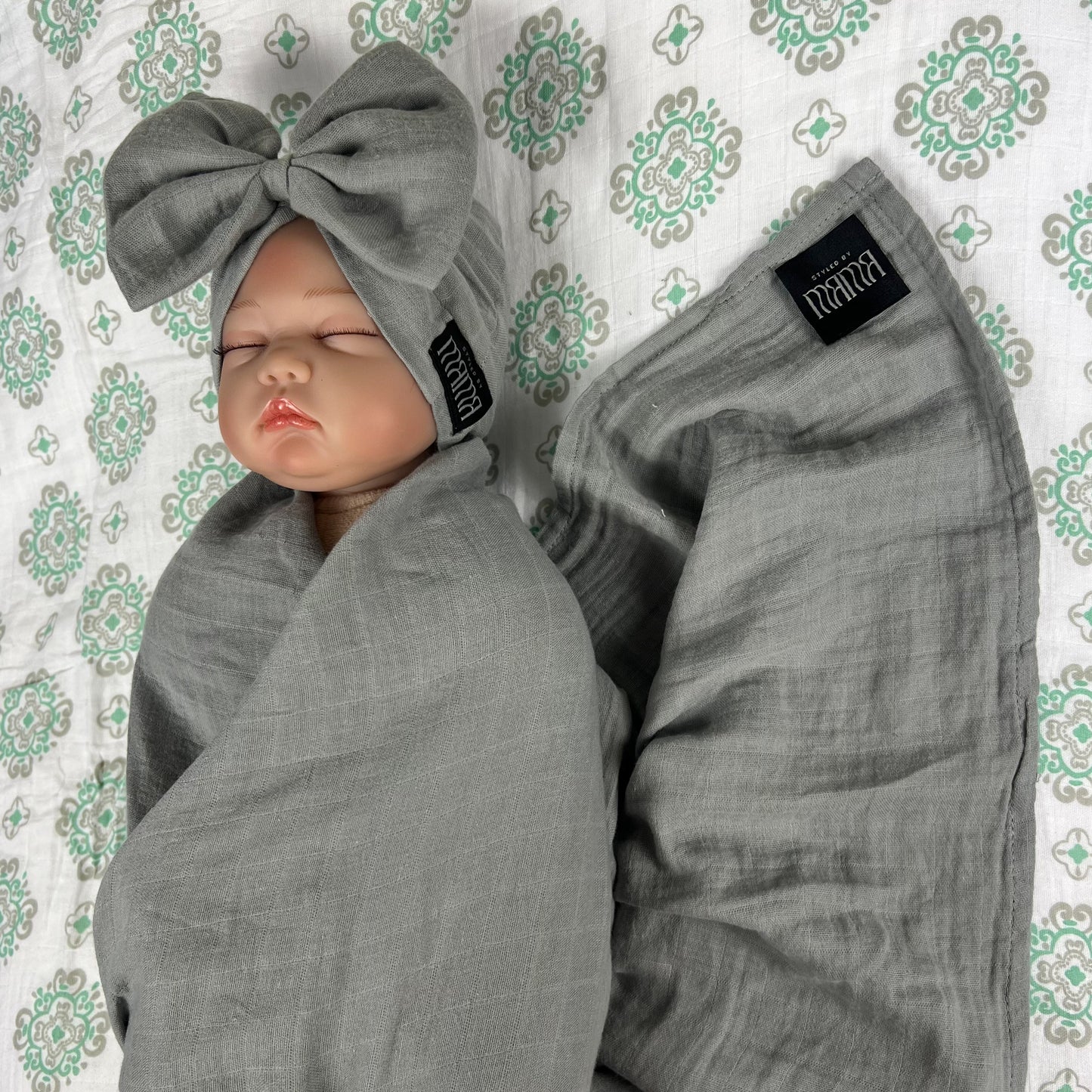 Solid moss grey muslin organic cotton swaddles styled by mommy and me arabia