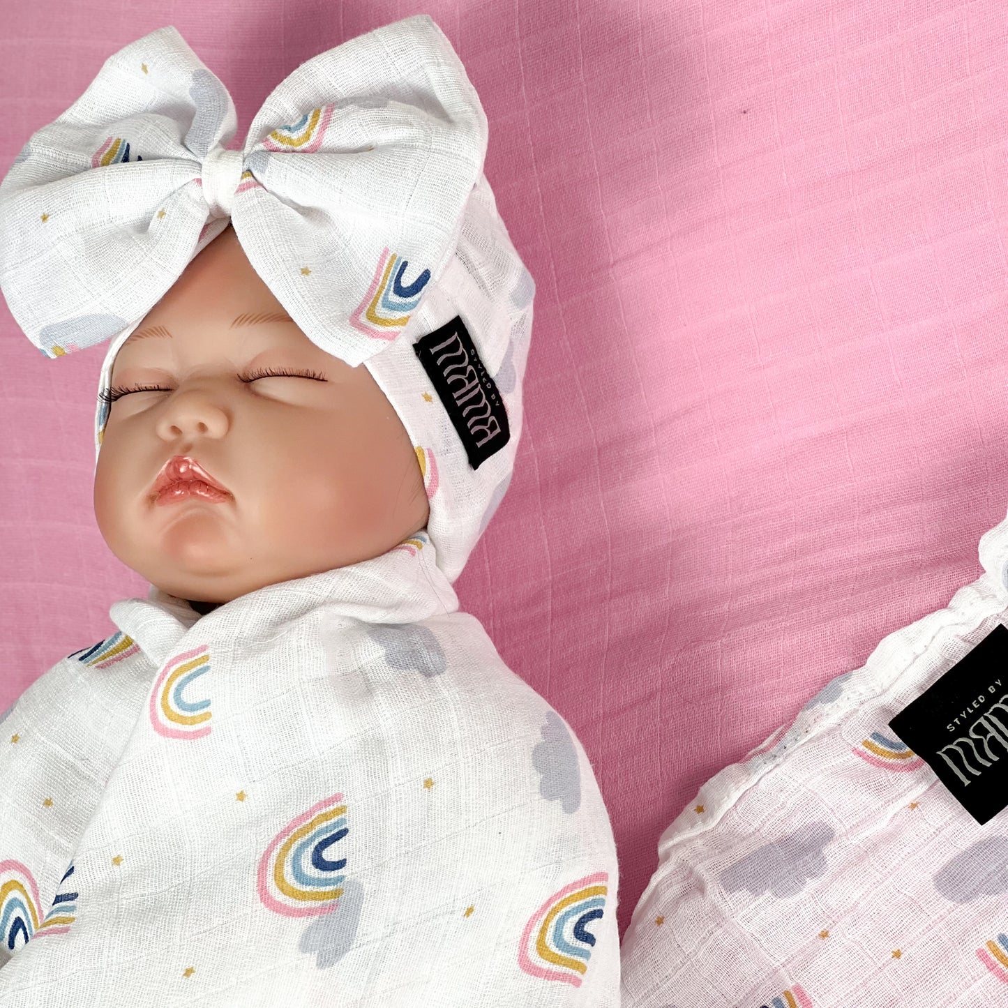 Baby rainbow printed Muslin organic cotton swaddles styled by mommy and me arabia