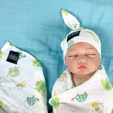 Load image into Gallery viewer, Turtle World printed Muslin organic cotton swaddles styled by mommy and me arabia
