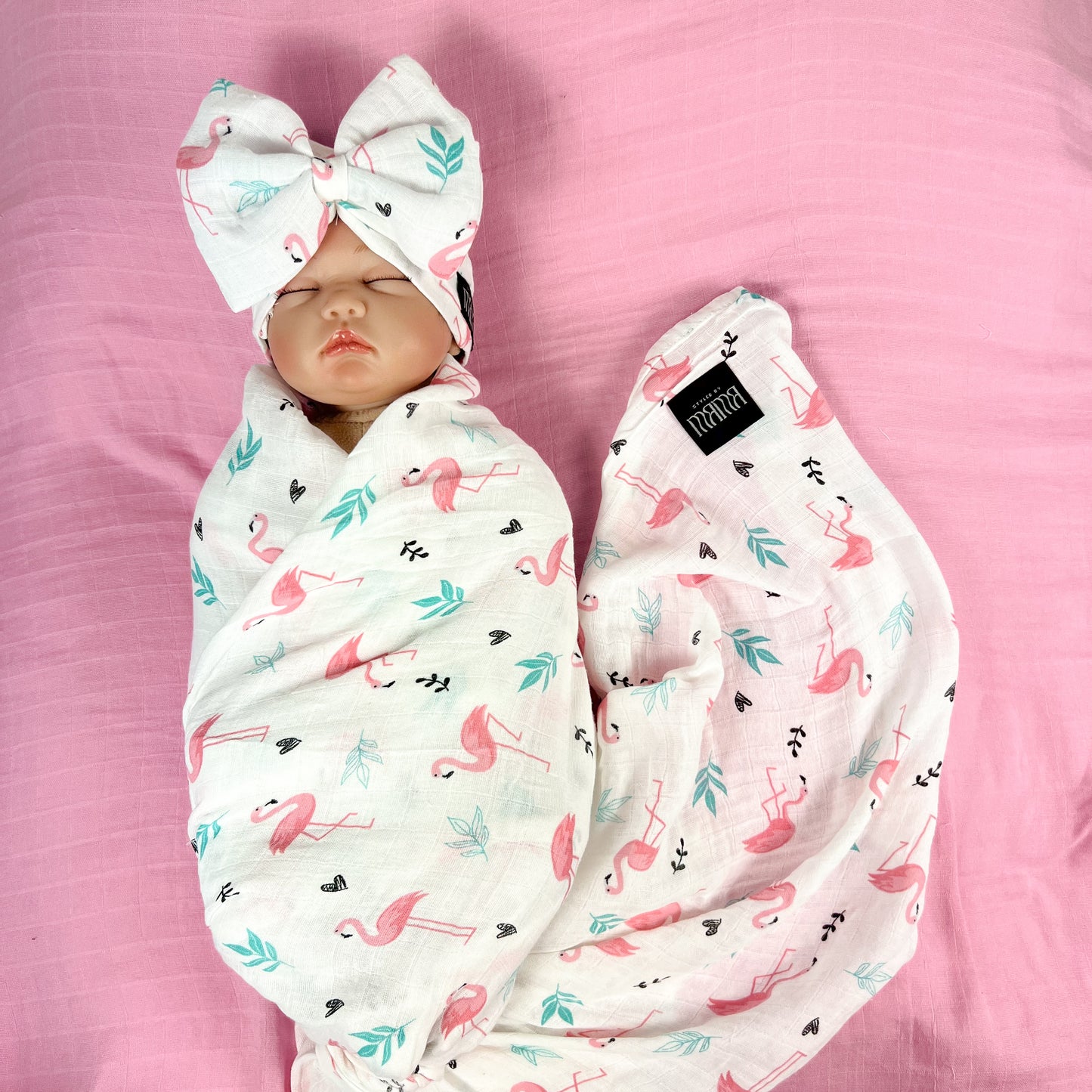 Baby flamingo pink printed Muslin organic cotton swaddles styled by mommy and me arabia