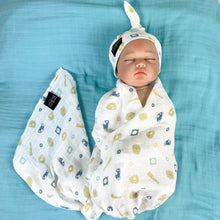 Load image into Gallery viewer, Baby baseball print Muslin organic cotton swaddles styled by mommy and me arabia
