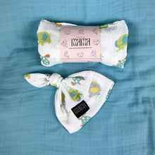 Load image into Gallery viewer, Turtle World printed Muslin organic cotton swaddles styled by mommy and me arabia
