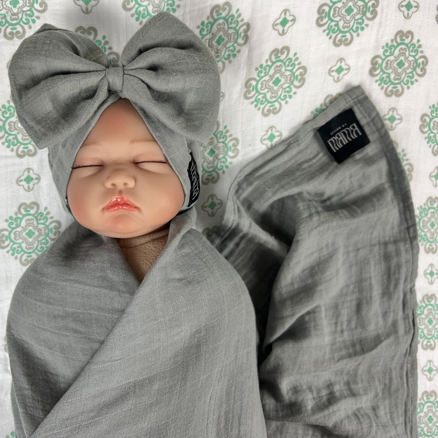 Solid moss grey muslin organic cotton swaddles styled by mommy and me arabia