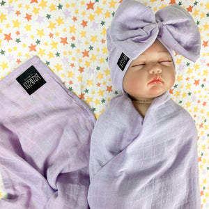 Solid baby purple muslin organic cotton swaddles styled by mommy and me arabia