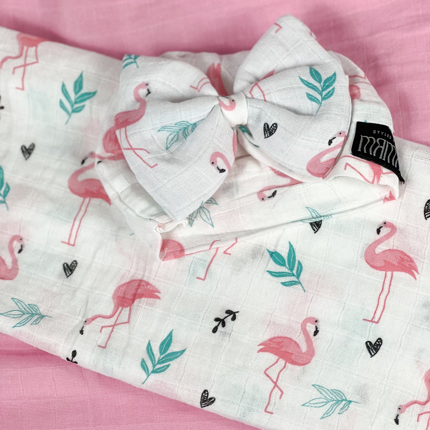 Baby flamingo pink printed Muslin organic cotton swaddles styled by mommy and me arabia