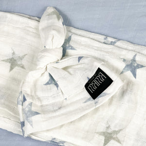 Baby blue stars print muslin organic cotton swaddles styled by mommy and me Arabia