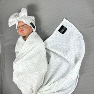 Green polka dots printed Muslin organic cotton swaddles styled by mommy and me arabia