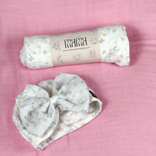 Load image into Gallery viewer, Happy bunny pink printed Muslin organic cotton swaddles styled by mommy and me arabia
