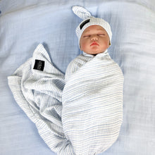 Load image into Gallery viewer, Baby blue stripes print muslin organic cotton swaddles styled by mommy and me arabia
