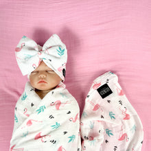 Load image into Gallery viewer, Baby flamingo pink printed Muslin organic cotton swaddles styled by mommy and me arabia
