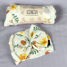 Load image into Gallery viewer, Sunshine blossom muslin organic cotton swaddles styled by mommy and me arabia
