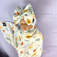 Load image into Gallery viewer, Sunshine blossom muslin organic cotton swaddles styled by mommy and me arabia
