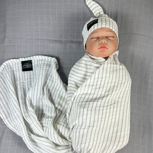 Grey stripes Muslin organic cotton swaddles styled by mommy and me arabia