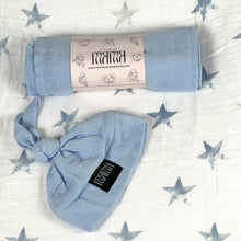 Load image into Gallery viewer, Solid baby blue muslin organic cotton swaddles styled by mommy and me arabia
