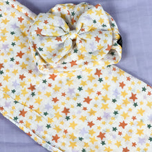 Load image into Gallery viewer, Yellow stars muslin organic cotton swaddles styled by mommy and me arabia
